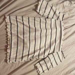 Caution to the wind ruffle hemmed off the shoulder crop top